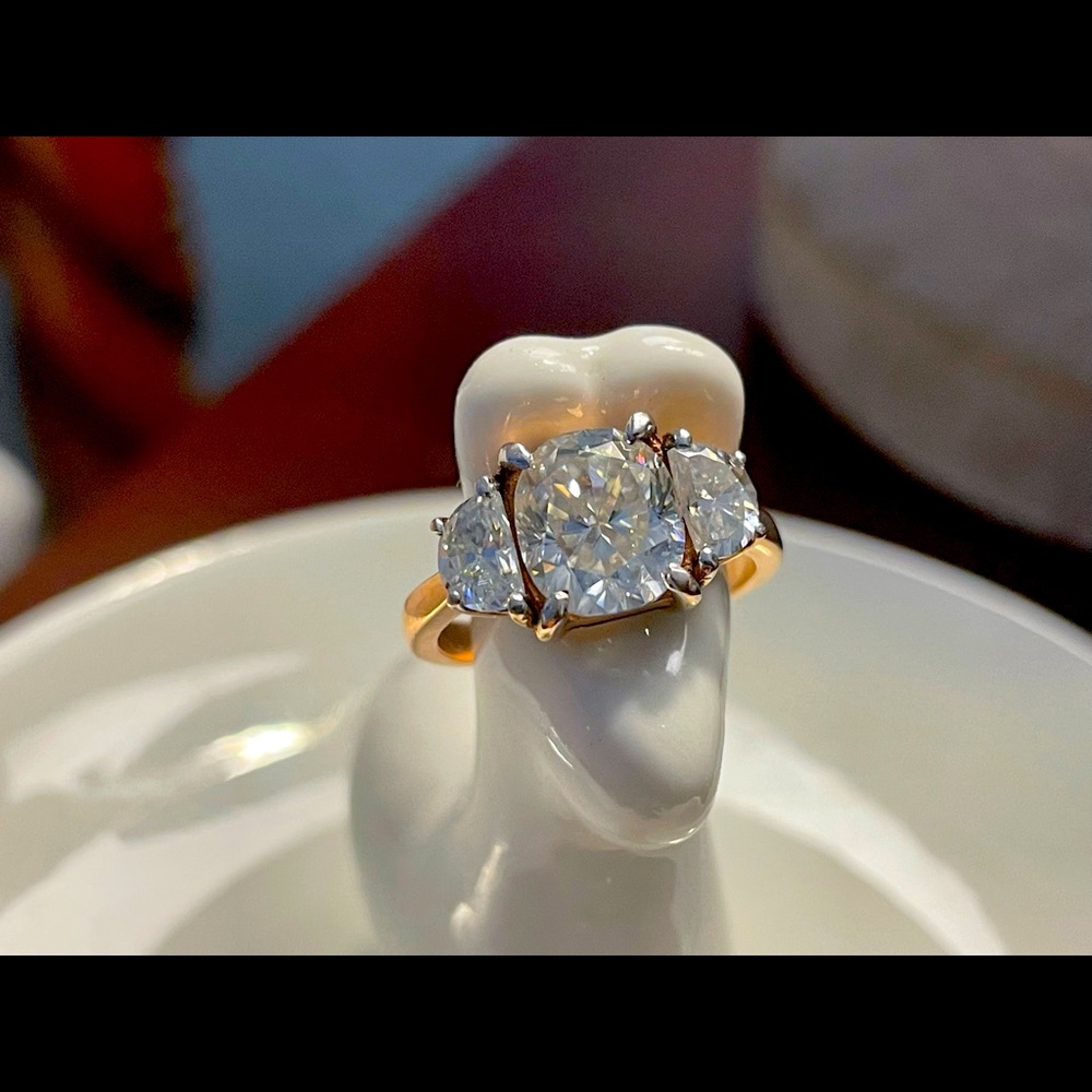 Moissanite and 10k rose gold ring.  Sizable 4